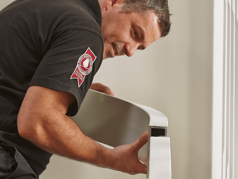 Specialist installing an acorn stairlift rail